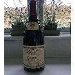 A bottle of Louis Jadot Beaune Premier Cru 2010.