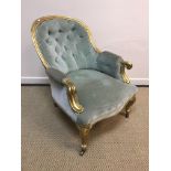 A Victorian salon tub chair with buttoned back pale green upholstery and gilt frame,