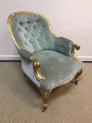 A Victorian salon tub chair with buttoned back pale green upholstery and gilt frame,