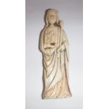 An 18th Century (or possibly earlier) carved ivory religious figure in robes holding staff and