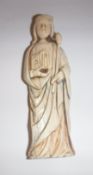 An 18th Century (or possibly earlier) carved ivory religious figure in robes holding staff and