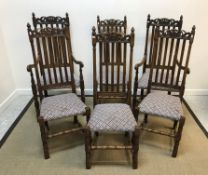 A set of early 20th Century oak dining chairs in the Carolean style,