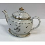 A circa 1800 monochrome and gilt decorated teapot and cover on stand,