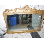 A modern gilt framed mirror in the 19th Century manner with scrolling and acanthus decoration,