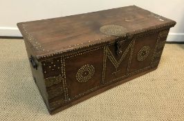 A teak and brass studded and embellished Zanzibar chest of typical form,
