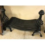 A modern cast and wrought iron fire basket with open wrythen design dogs, 81 cm wide x 41.