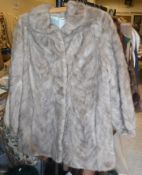 A brown mink jacket with satin lining,