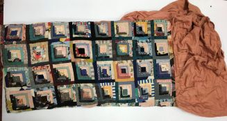 A vintage patchwork quilt mounted as a bedspread