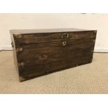 A 19th Century camphor wood / teak and brass bound trunk,