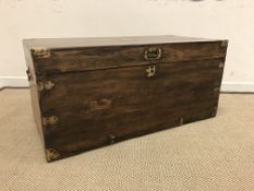 A 19th Century camphor wood / teak and brass bound trunk,