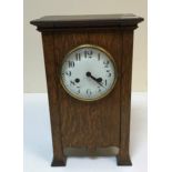 A circa 1900 oak cased mantel clock in the Art Nouveau style,