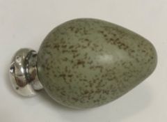 A Victorian porcelain and silver mounted scent bottle in the form of an egg,