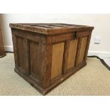 A vintage pine trunk with panelled top and sides, raised on a plinth base, 78.5 cm wide x 49.