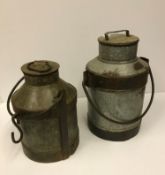 Two vintage style milk churns, one approx 44 cm high,