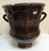 A large twin-handled stoneware jar, 55 cm high, together with an ocean find terracotta jug,