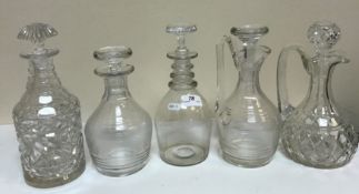 A collection of assorted glassware to include various decanters, drinking glasses,