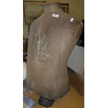 A vintage tailor's dummy torso on stand