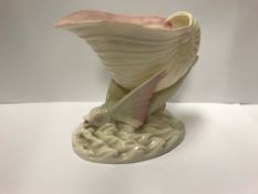 A Belleek "Nautilus" shell dish on flying fish decorated base, bears black printed mark,