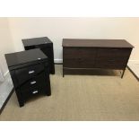 A pair of modern black glass covered three drawer bedside chests,