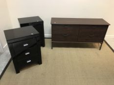 A pair of modern black glass covered three drawer bedside chests,