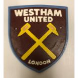 A modern painted cast iron sign inscribed "West Ham United", approx 21.