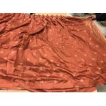 Two pairs of cotton mix terracotta ground interlined curtains, with gold C scrolling decoration,