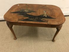 An early 20th Century walnut coffee table with chinoiserie decoration to top,