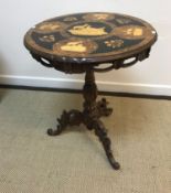 A 19th Century Black Forest tripod table,