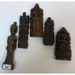 A collection of five ethnic carved wooden figures, three with plaited pony tails verso, tallest 24.