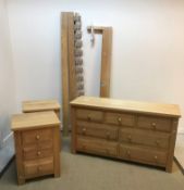 A modern oak chest of three short over four long drawers on stile supports,