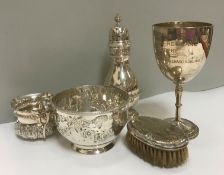 A collection of silver wares to include a Victorian silver sugar bowl with embossed floral swag