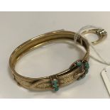 A Victorian yellow metal bangle in the form of a belt,
