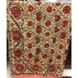 A 19th Century crewel work flower head decorated table cover or bedspread, approx double bed size,