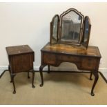 An early to mid 20th Century walnut kneehole dressing table with triple mirror, 99 cm wide x 52.