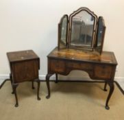 An early to mid 20th Century walnut kneehole dressing table with triple mirror, 99 cm wide x 52.