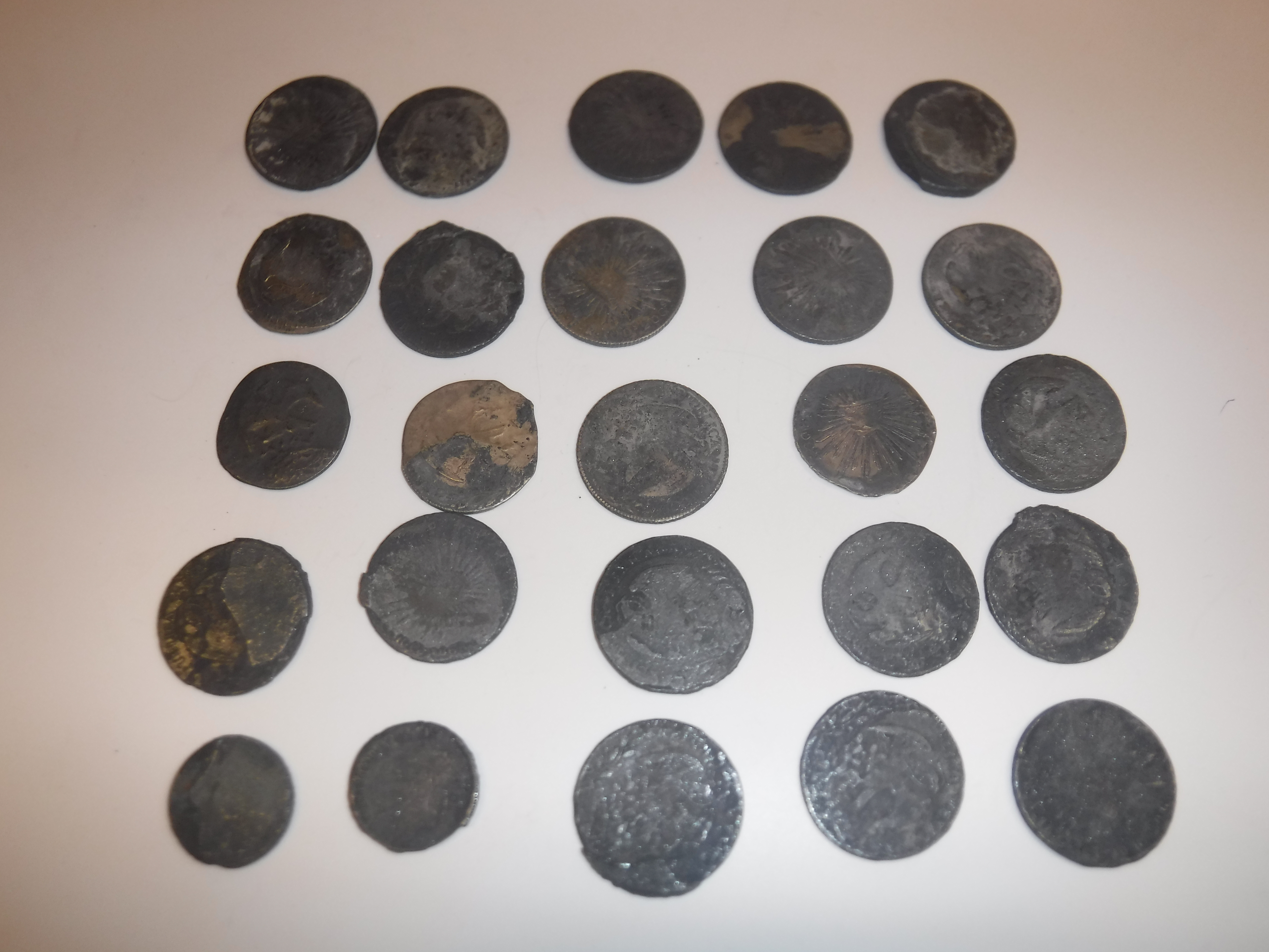 A collection of 25 Mexican silver 8 reale and other coins inscribed "Republica Mexicana" with eagle