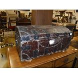 A 19th Century leather covered iron bound and brass studded trunk,