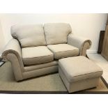 A modern Marks & Spencer two seat scroll arm sofa with fawn upholstery,