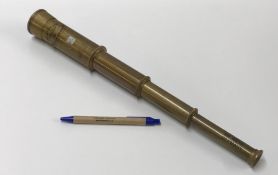 A modern decorative brass four draw telescope inscribed "Zeiss Opton NR122392 Germany" and bearing