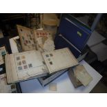 A box containing a collection of various mounted and unmounted British and World stamps in various