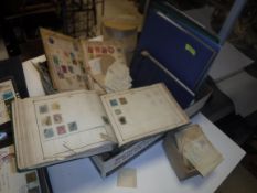 A box containing a collection of various mounted and unmounted British and World stamps in various