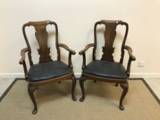 A set of four Queen Anne style elbow chairs, with upholstered seats,