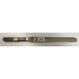 A 19th Century Chinese paperknife with jade and white metal banded handle and white metal blade,