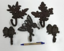 Two oak leaf and acorn decorated wall hooks, approx 19 cm high, a pair of bird decorated wall hooks,