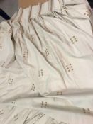 A pair of linen type cream ground lined curtains with gold thread detail,