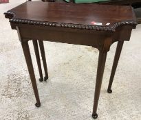 An early 20th Century mahogany fold-over card table,