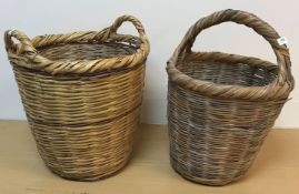 Three large canework baskets,