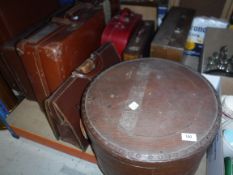 A collection of vintage suitcases, a wooden duplicator box (only),