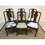 A set of six early to mid 20th Century walnut dining chairs in the early 18th Century manner,