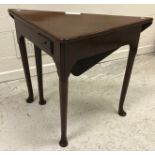 A George II mahogany corner table,